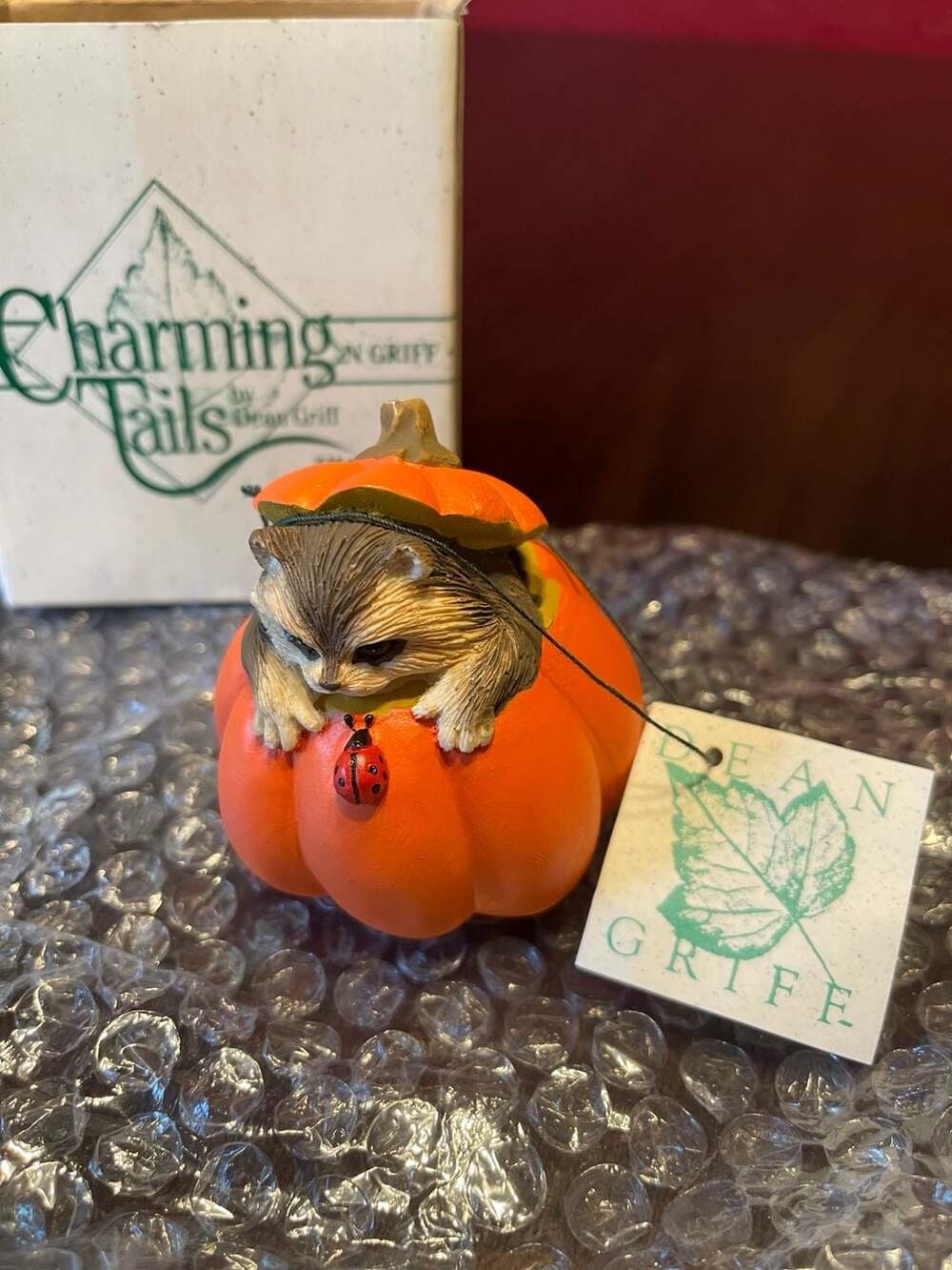 Charming Tails Reginald's Hideaway Raccoon in Pumpkin Figurine by Dean Griff